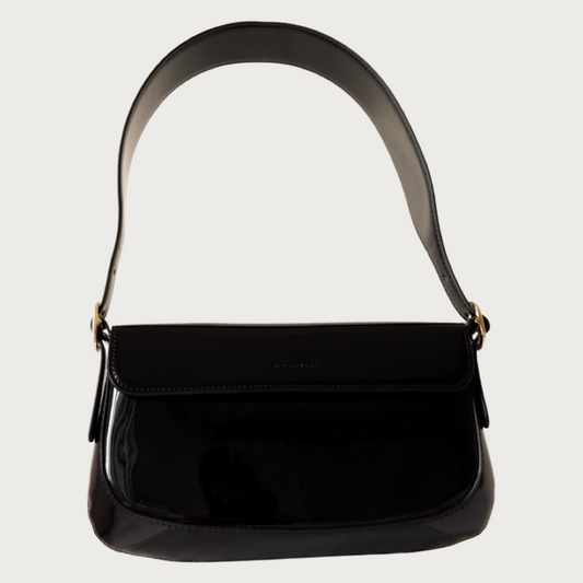 Unique baguette bag made by glossy vegan leather with asymmetrical shape.